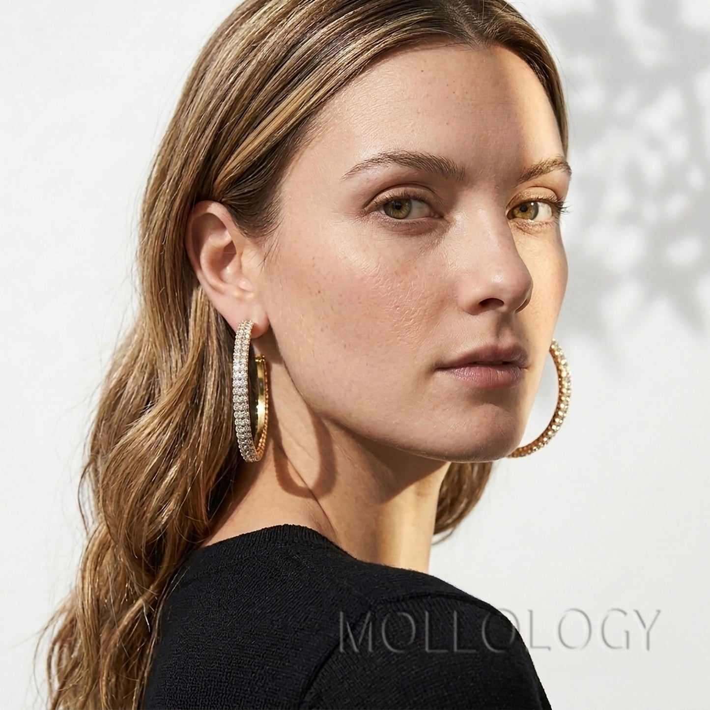 Large gold CZ hoop earrings styled on model, sparkly statement circle earrings by MOLLOLOGY.