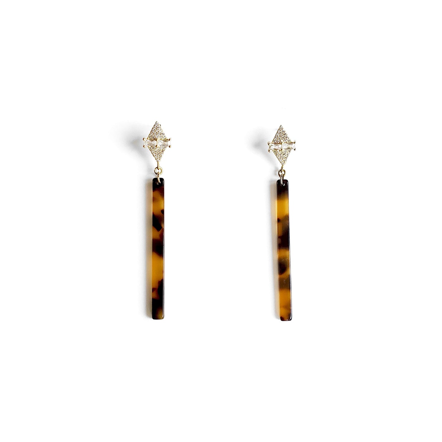 Dainty tortoiseshell bar earrings with a geometric gold accent displayed on a white background.
