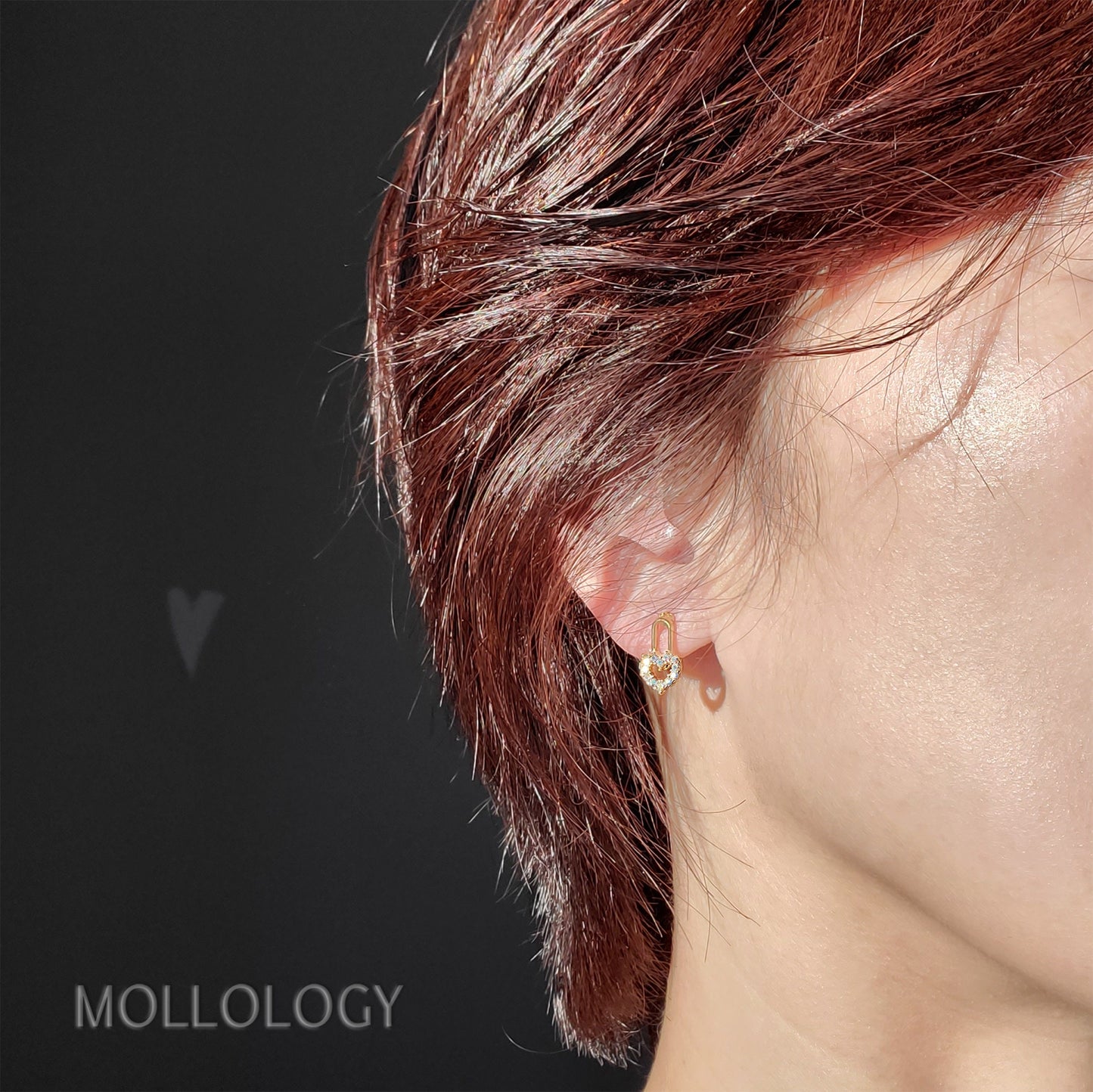 woman wearing heart love stud earring