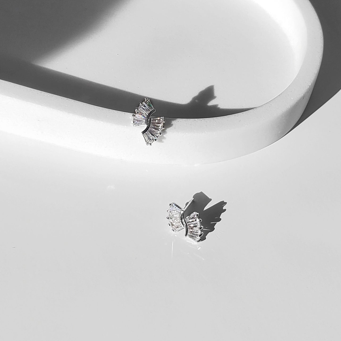 This elegant Art Deco–inspired design makes a beautiful choice for brides, bridesmaids, and anyone who loves timeless sparkle. These baguette bridal earrings feature dainty CZ sunburst studs available in gold or silver, perfect for minimalist wedding earrings that still make a statement.