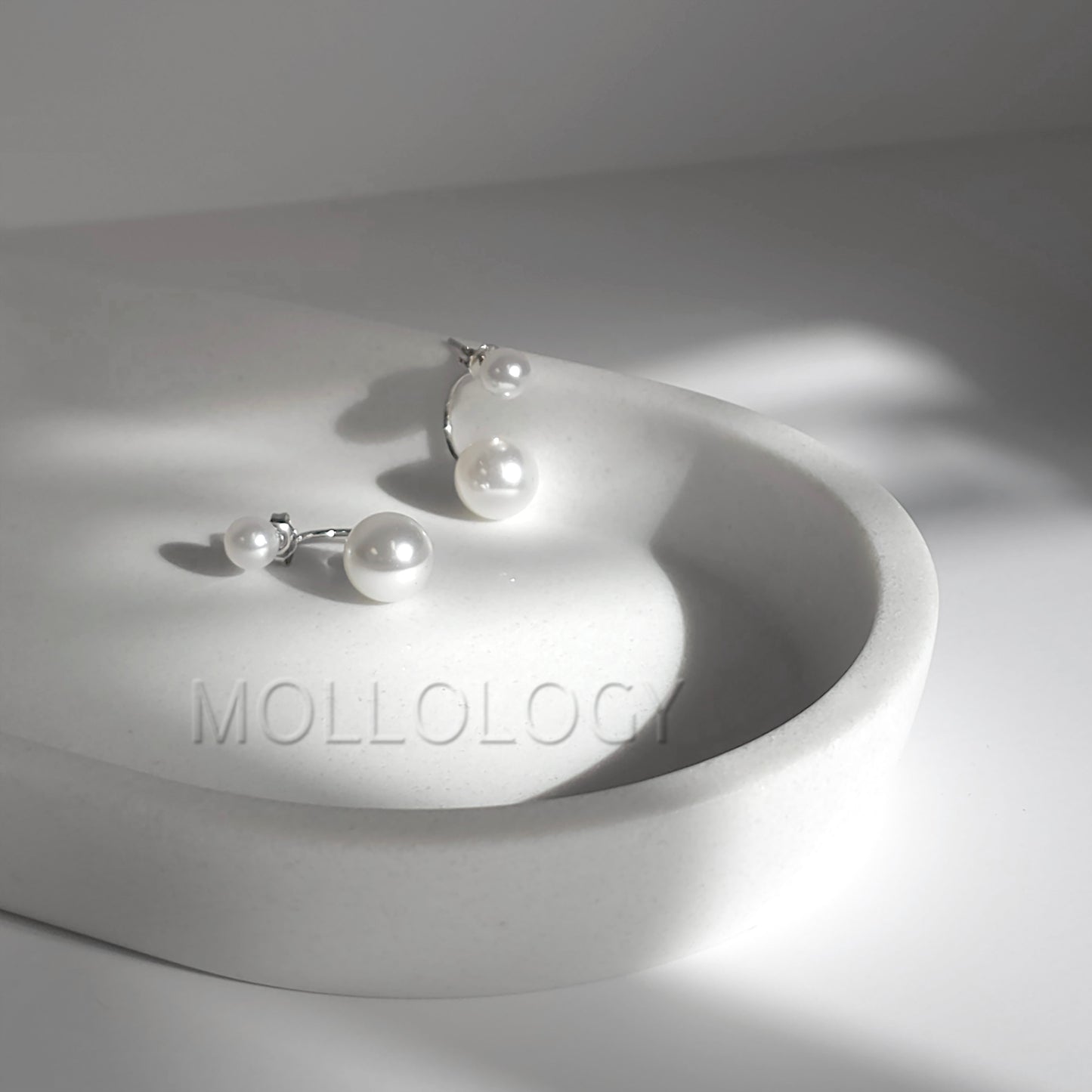 Double Pearl Earrings, handmade jewelry designed to be elegant, meaningful, and beautifully gift ready. These dainty ear jacket earrings add timeless charm to any look, featuring a modern wrap-behind design that gently curves behind the earlobe. Perfect for weddings, bridal styling, holidays, birthdays, anniversaries, or everyday wear, their soft luminous glow brings a classic yet contemporary feel to every outfit.