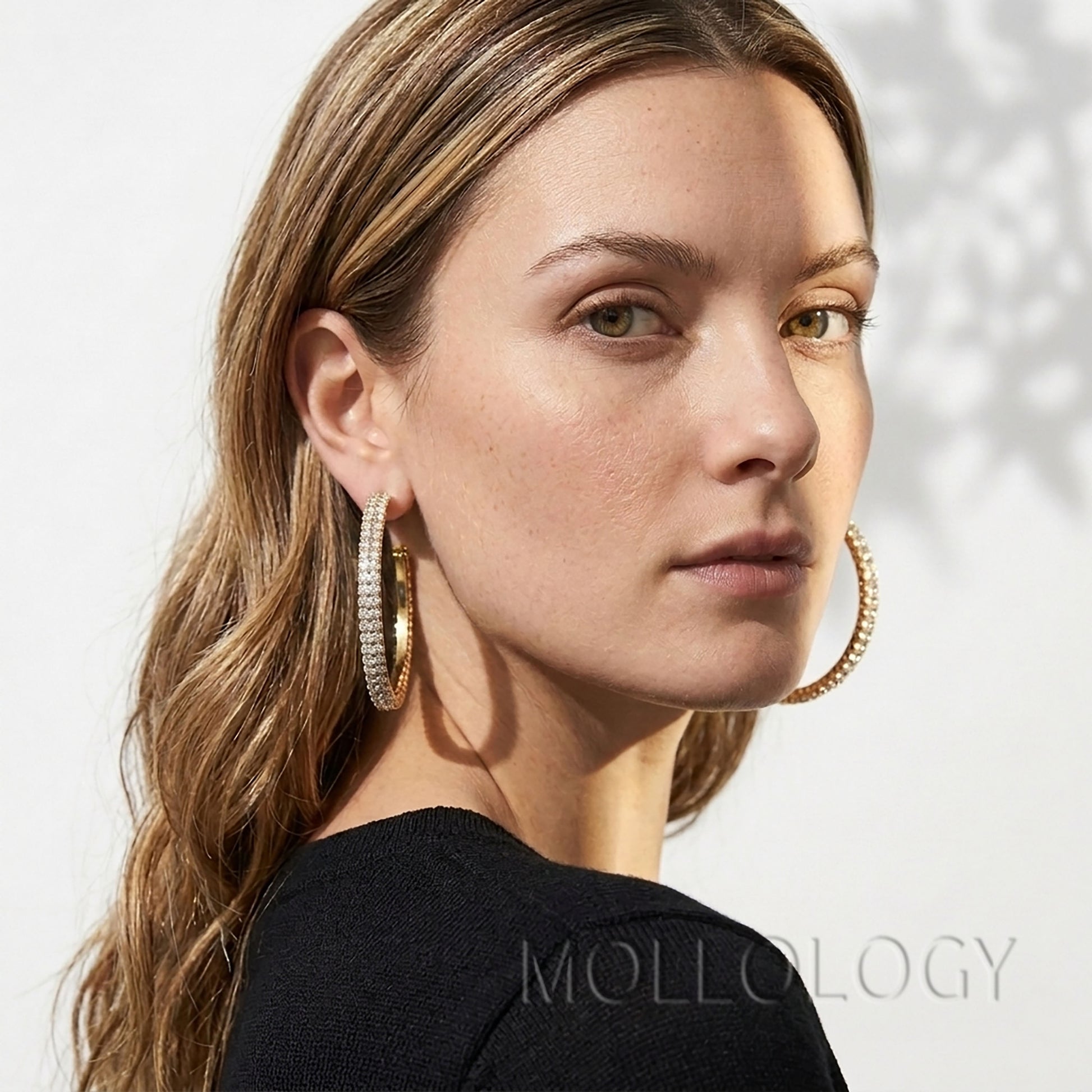 Large gold CZ hoop earrings styled on model, sparkly statement circle earrings by MOLLOLOGY.