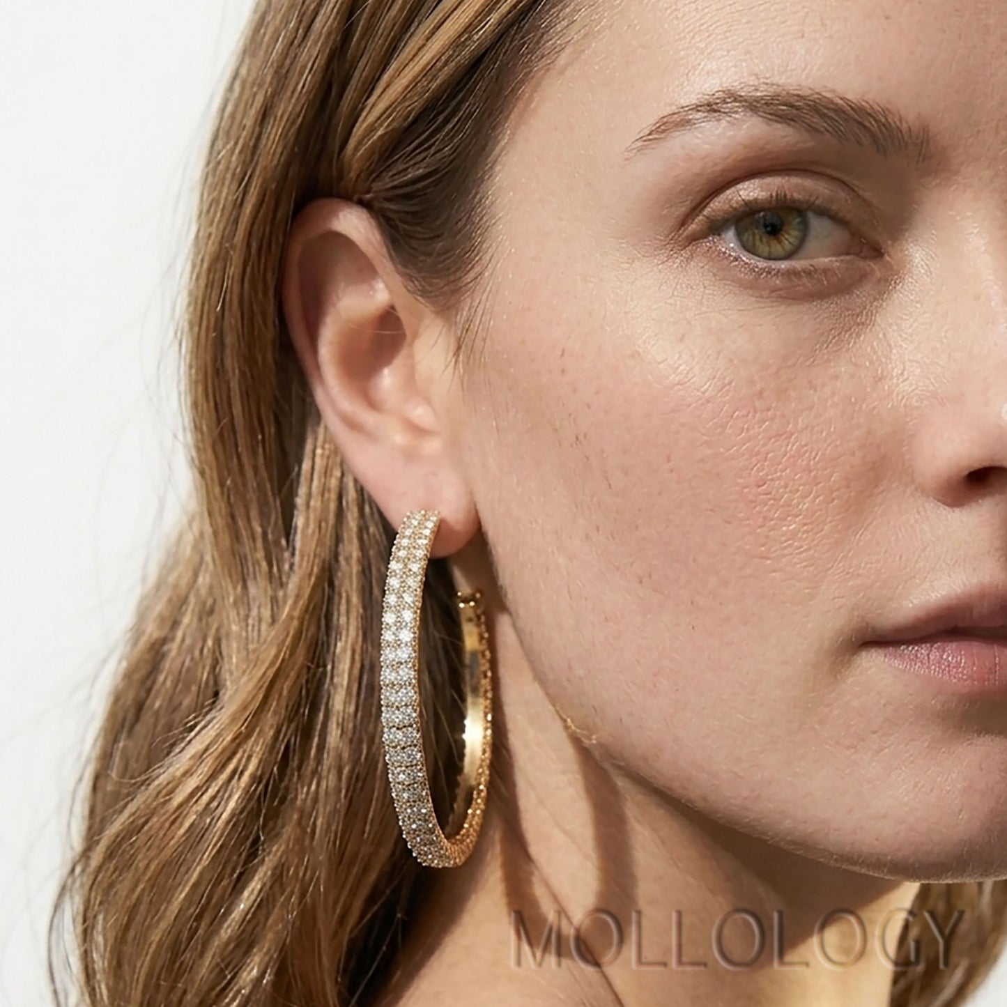 Large gold CZ hoop earrings styled on model, sparkly statement circle earrings by MOLLOLOGY.