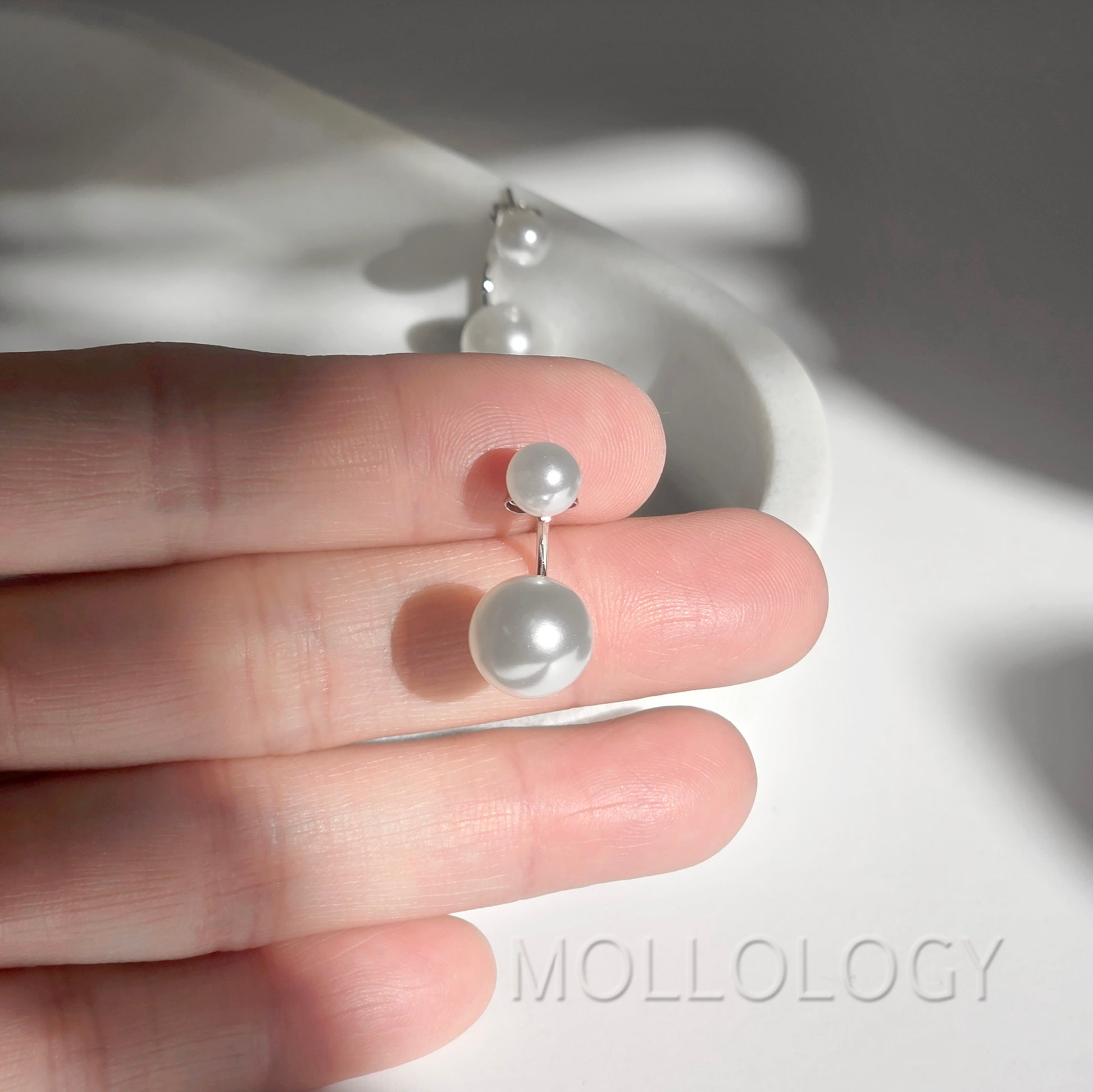 Double Pearl Earrings, handmade jewelry designed to be elegant, meaningful, and beautifully gift ready. These dainty ear jacket earrings add timeless charm to any look, featuring a modern wrap-behind design that gently curves behind the earlobe. Perfect for weddings, bridal styling, holidays, birthdays, anniversaries, or everyday wear, their soft luminous glow brings a classic yet contemporary feel to every outfit.