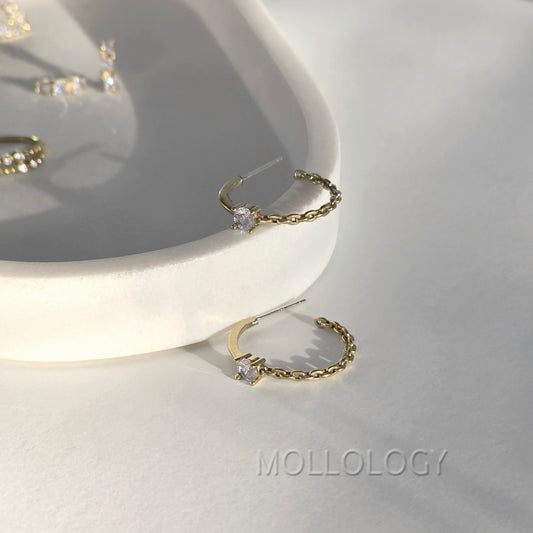 Dainty gold chain hoop earrings with CZ stone on white tray, minimalist MOLLOLOGY jewelry product photo.