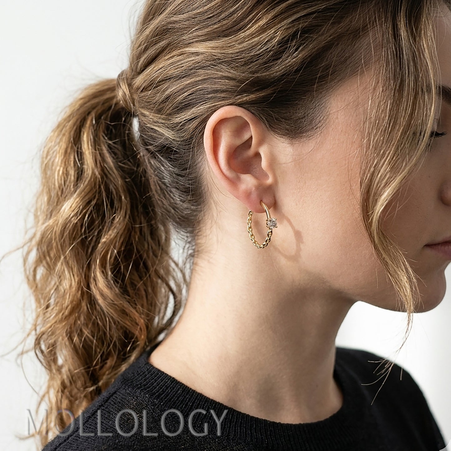 Gold chain hoop earrings with CZ worn on ear, dainty everyday hoops styled on model, MOLLOLOGY jewelry.