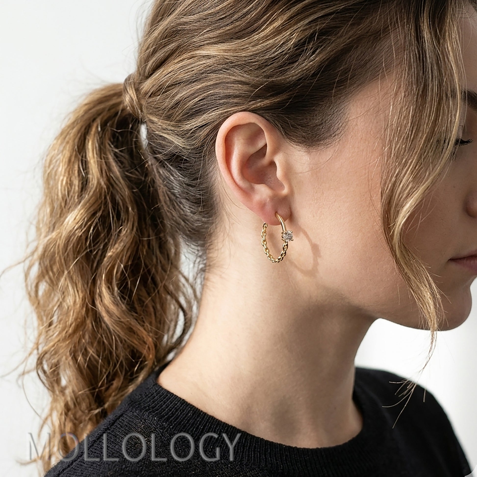 Gold chain hoop earrings with CZ worn on ear, dainty everyday hoops styled on model, MOLLOLOGY jewelry.