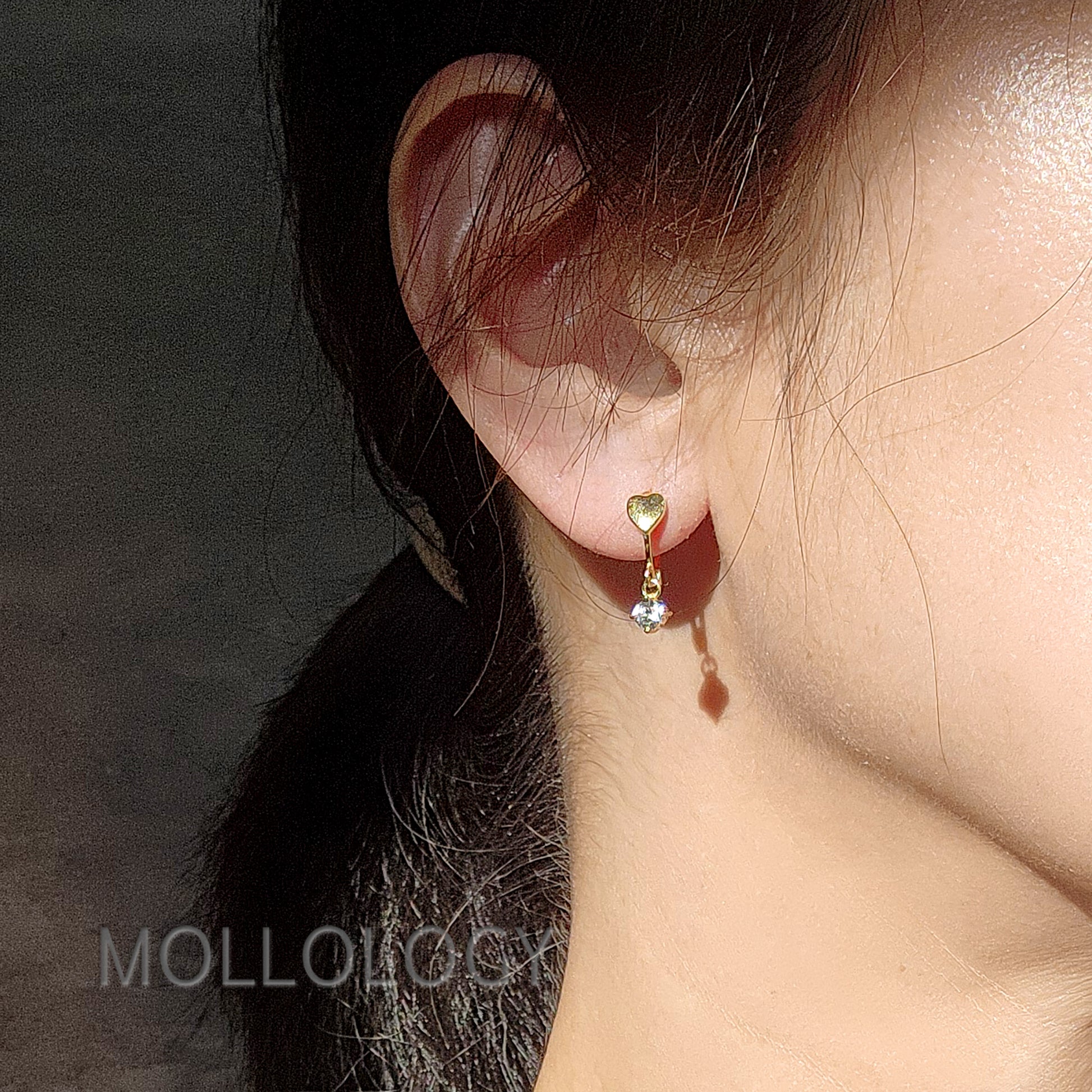 Minimalist jewelry gift for teens featuring gold heart huggies.