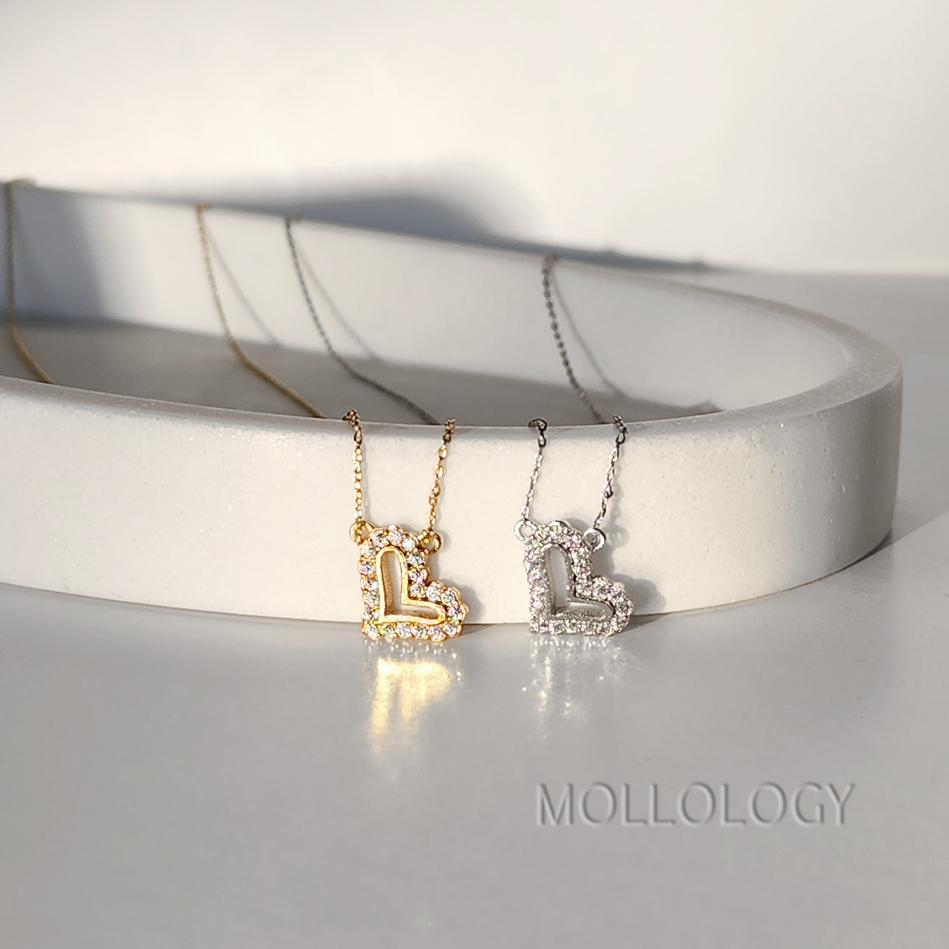 Add a touch of timeless elegance with this Dainty Heart Necklace. Featuring a minimalist pave diamond heart pendant, this delicate piece shines with understated luxury — perfect for everyday wear, bridal jewelry, or a romantic Valentine’s Day gift. A symbol of love and modern sophistication, it layers beautifully or stands gracefully on its own.