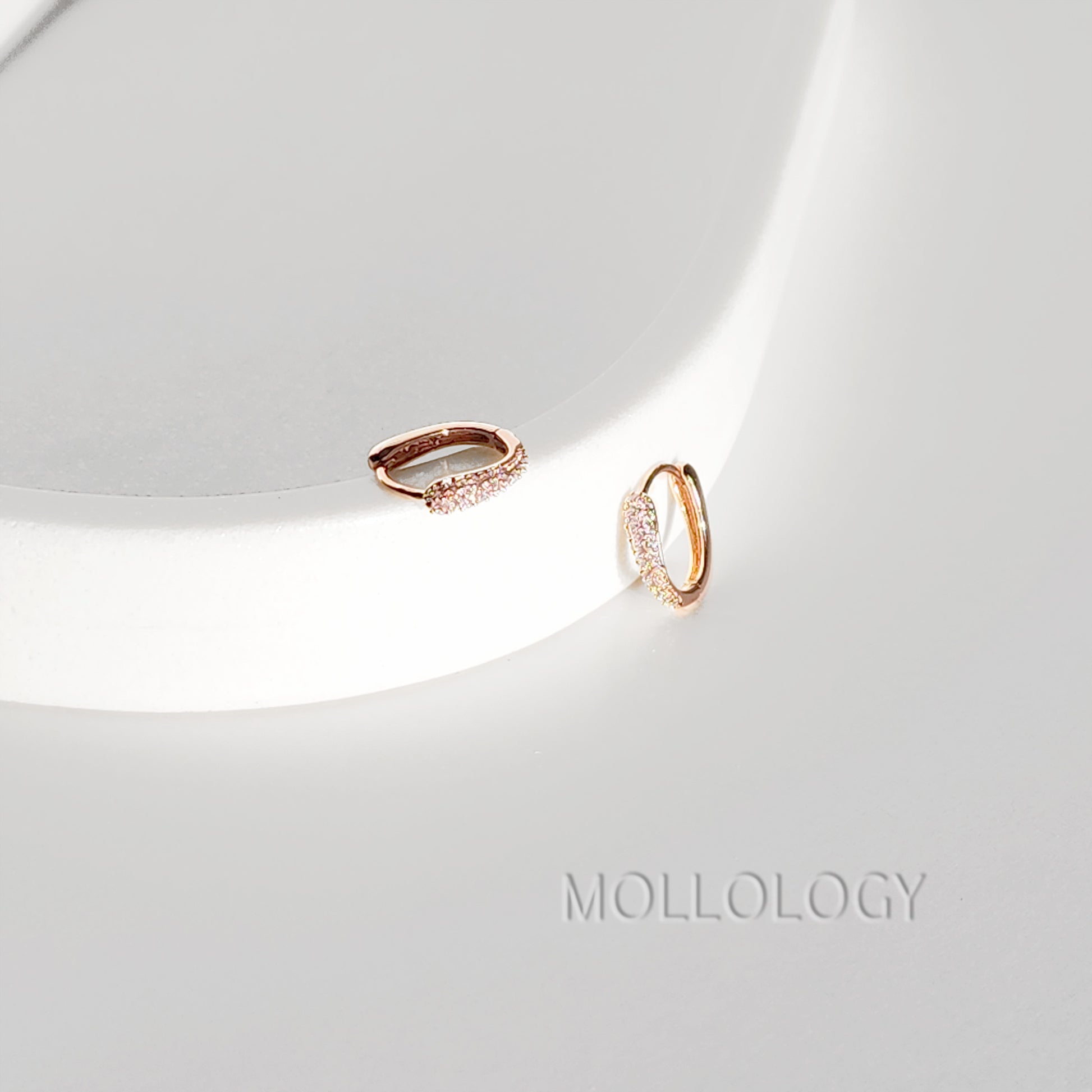 Delicate rose gold huggie hoop earrings with sparkling pavé cubic zirconia. Minimalist, dainty, and lightweight—perfect small hoops for everyday wear, cartilage piercings, or stacking. Timeless thin hoop earrings in rose gold or white gold.
