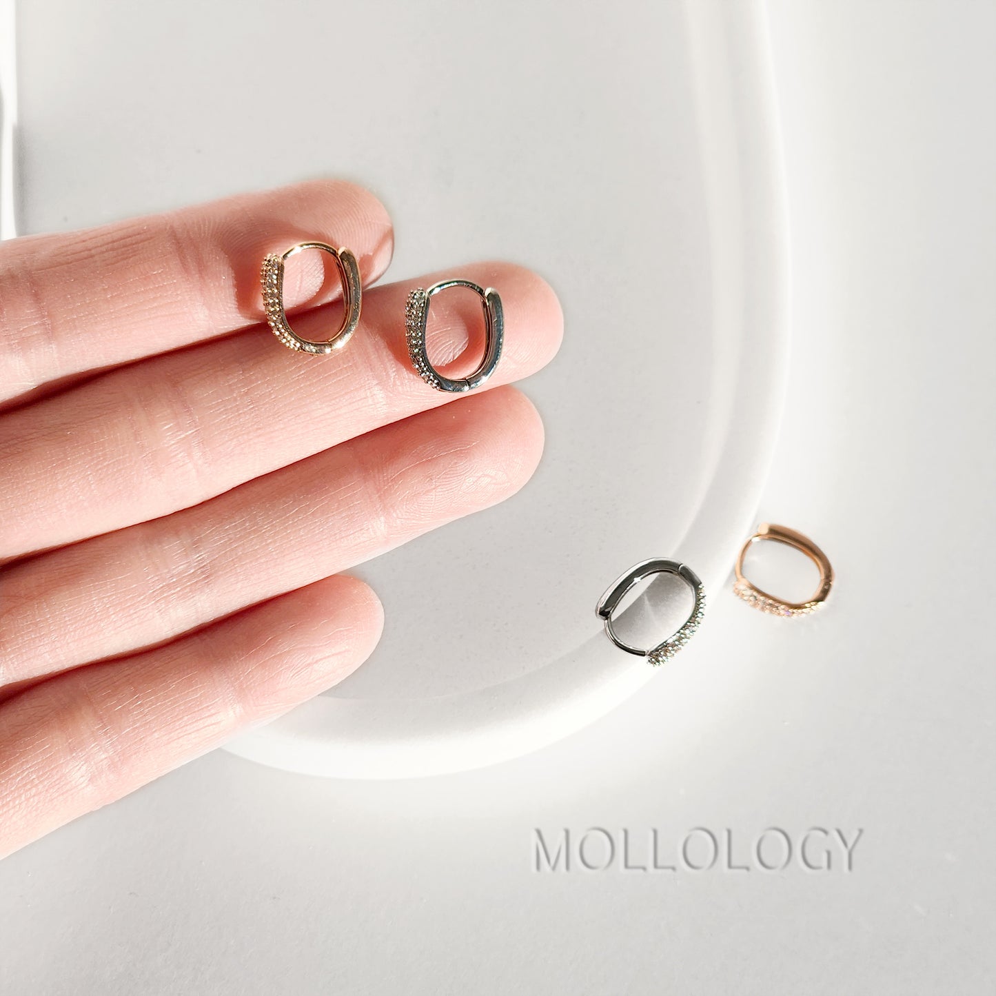 Delicate rose gold huggie hoop earrings with sparkling pavé cubic zirconia. Minimalist, dainty, and lightweight—perfect small hoops for everyday wear, cartilage piercings, or stacking. Timeless thin hoop earrings in rose gold or white gold.