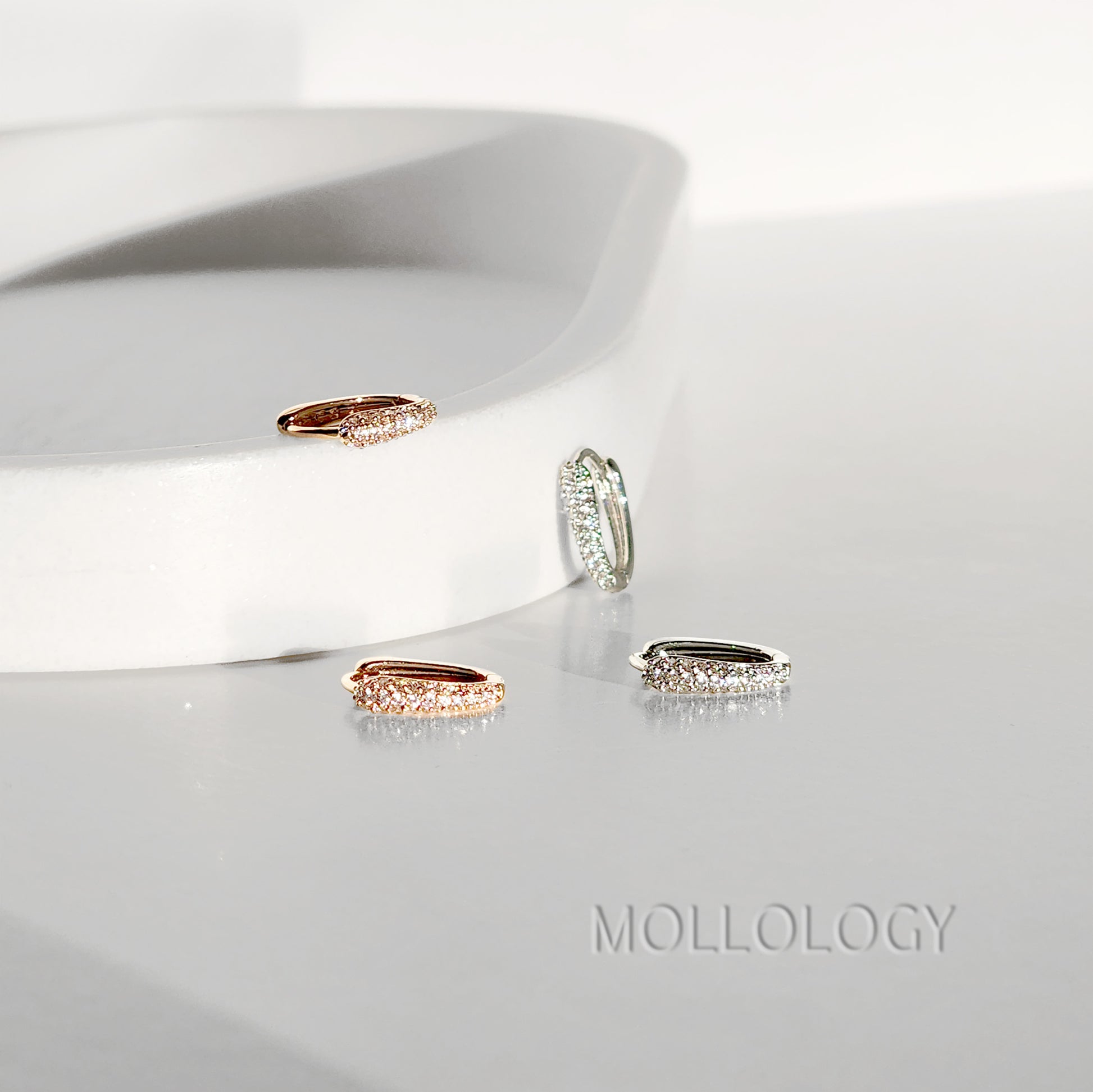 Delicate rose gold huggie hoop earrings with sparkling pavé cubic zirconia. Minimalist, dainty, and lightweight—perfect small hoops for everyday wear, cartilage piercings, or stacking. Timeless thin hoop earrings in rose gold or white gold.