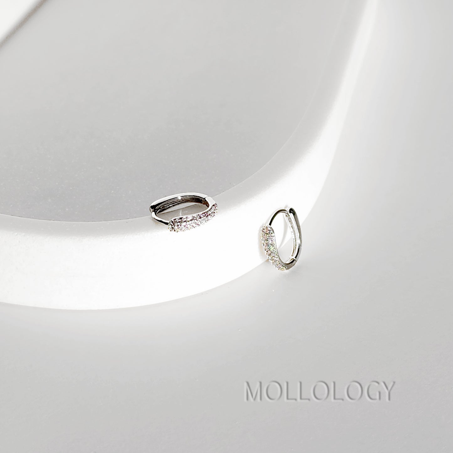 Delicate rose gold huggie hoop earrings with sparkling pavé cubic zirconia. Minimalist, dainty, and lightweight—perfect small hoops for everyday wear, cartilage piercings, or stacking. Timeless thin hoop earrings in rose gold or white gold.