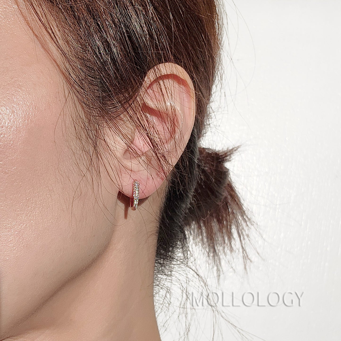 Delicate rose gold huggie hoop earrings with sparkling pavé cubic zirconia. Minimalist, dainty, and lightweight—perfect small hoops for everyday wear, cartilage piercings, or stacking. Timeless thin hoop earrings in rose gold or white gold.
