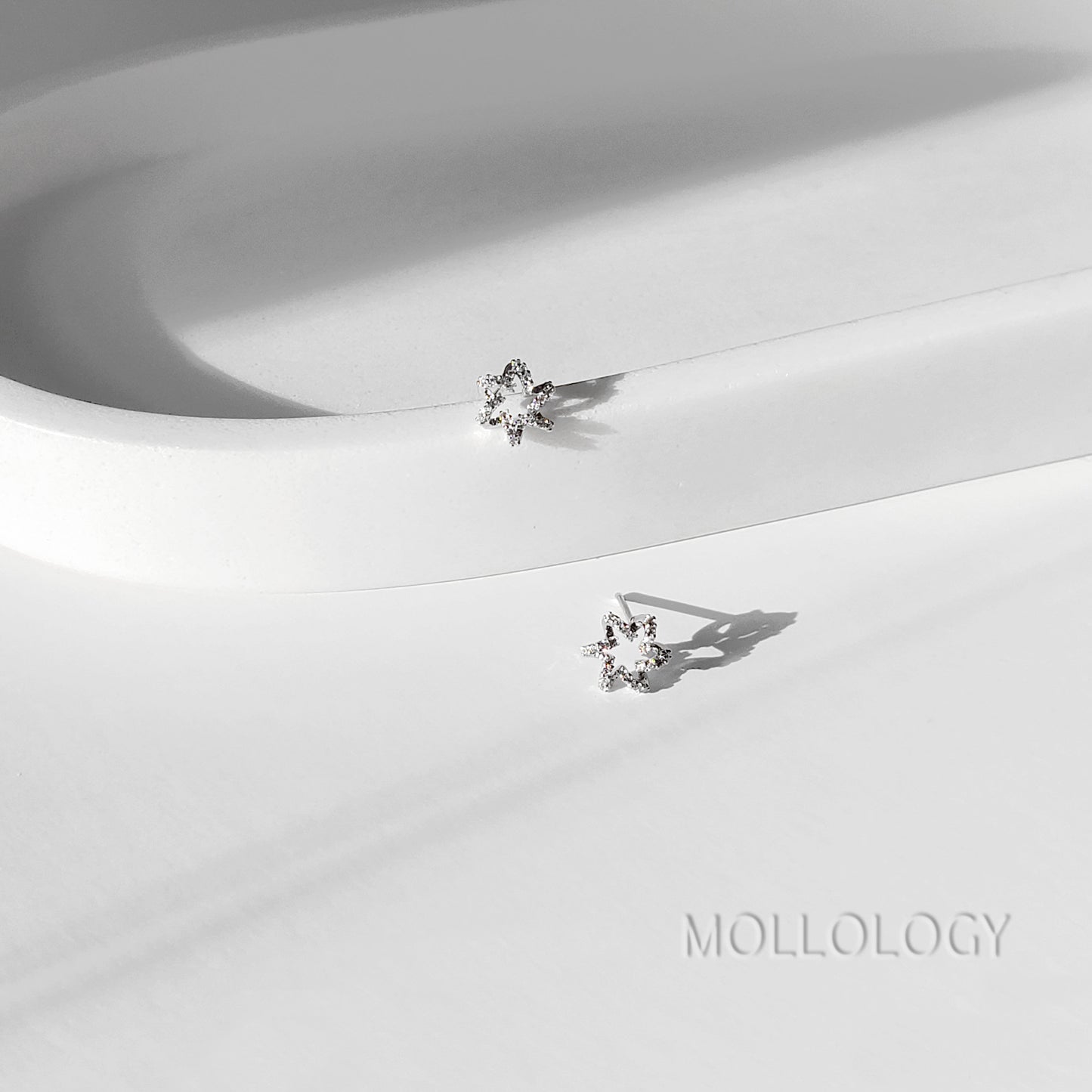 These dainty starburst floral earrings feature a delicate flower-inspired design with sparkling CZ, available in gold or silver for a soft, feminine look. Perfect as everyday dainty studs or special-occasion jewelry, they work beautifully as bridesmaids earrings, flower girl earrings, or wedding guest accessories. Lightweight and comfortable, these floral earrings make a sweet gift for her for birthdays, holidays, and celebrations.
