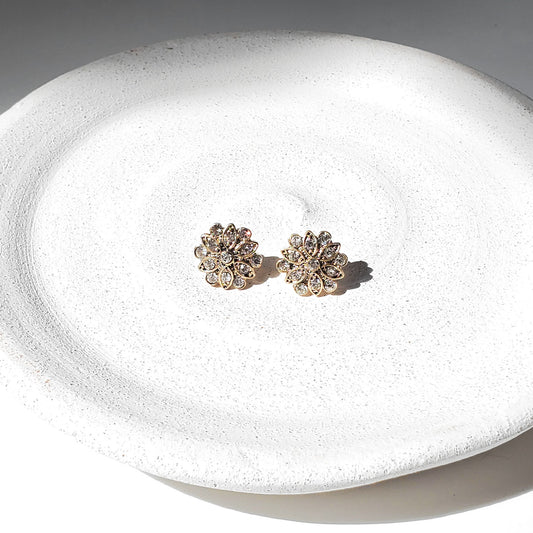 Dainty antique gold flower earrings with sparkling CZ stones in a mid-century, atomic sunburst design. Vintage-inspired floral studs perfect for brides, bridesmaids, weddings, special occasions, or elegant everyday wear. Timeless gold studs make a beautiful gift for her.