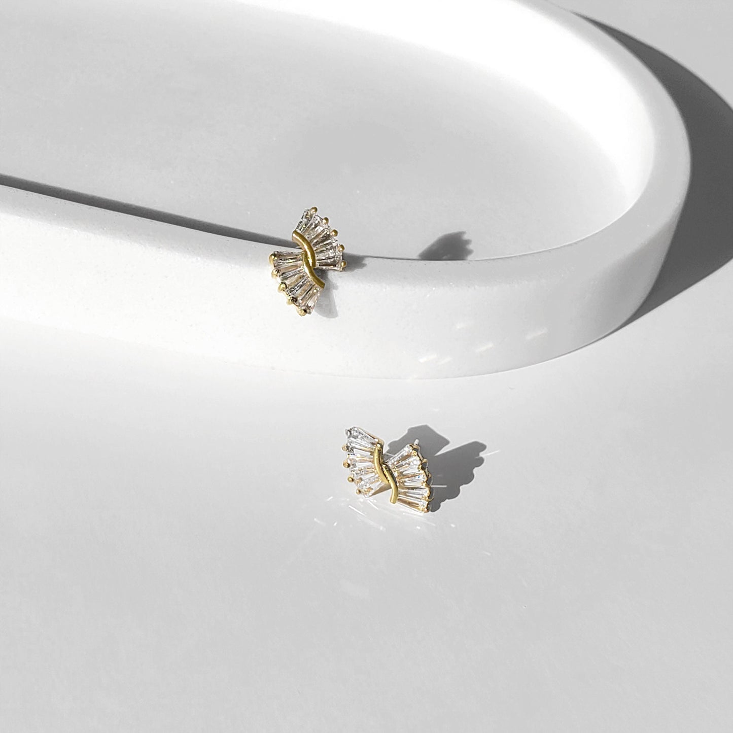 This elegant Art Deco–inspired design makes a beautiful choice for brides, bridesmaids, and anyone who loves timeless sparkle. These baguette bridal earrings feature dainty CZ sunburst studs available in gold or silver, perfect for minimalist wedding earrings that still make a statement.