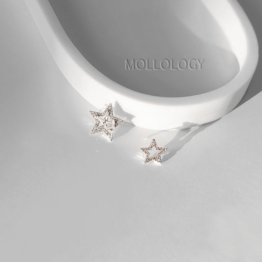 These dainty CZ star earrings feature a chic open star design with baguette details in shiny silver, creating modern celestial earrings that catch the light beautifully. Ideal as everyday star stud earrings or special-occasion jewelry, they are lightweight, comfortable, and perfect for stacking with other dainty silver earrings. Lovely as bridal and bridesmaids earrings, these star earrings make a thoughtful gift for her for birthdays, holidays, or weddings.