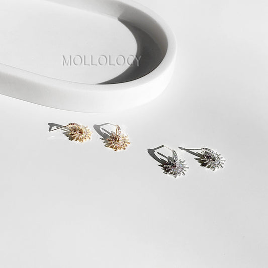 Gold starburst earrings with pavé CZ stones, Art Deco-inspired design, dainty bridal and wedding studs, perfect for bridesmaids or elegant everyday wear.