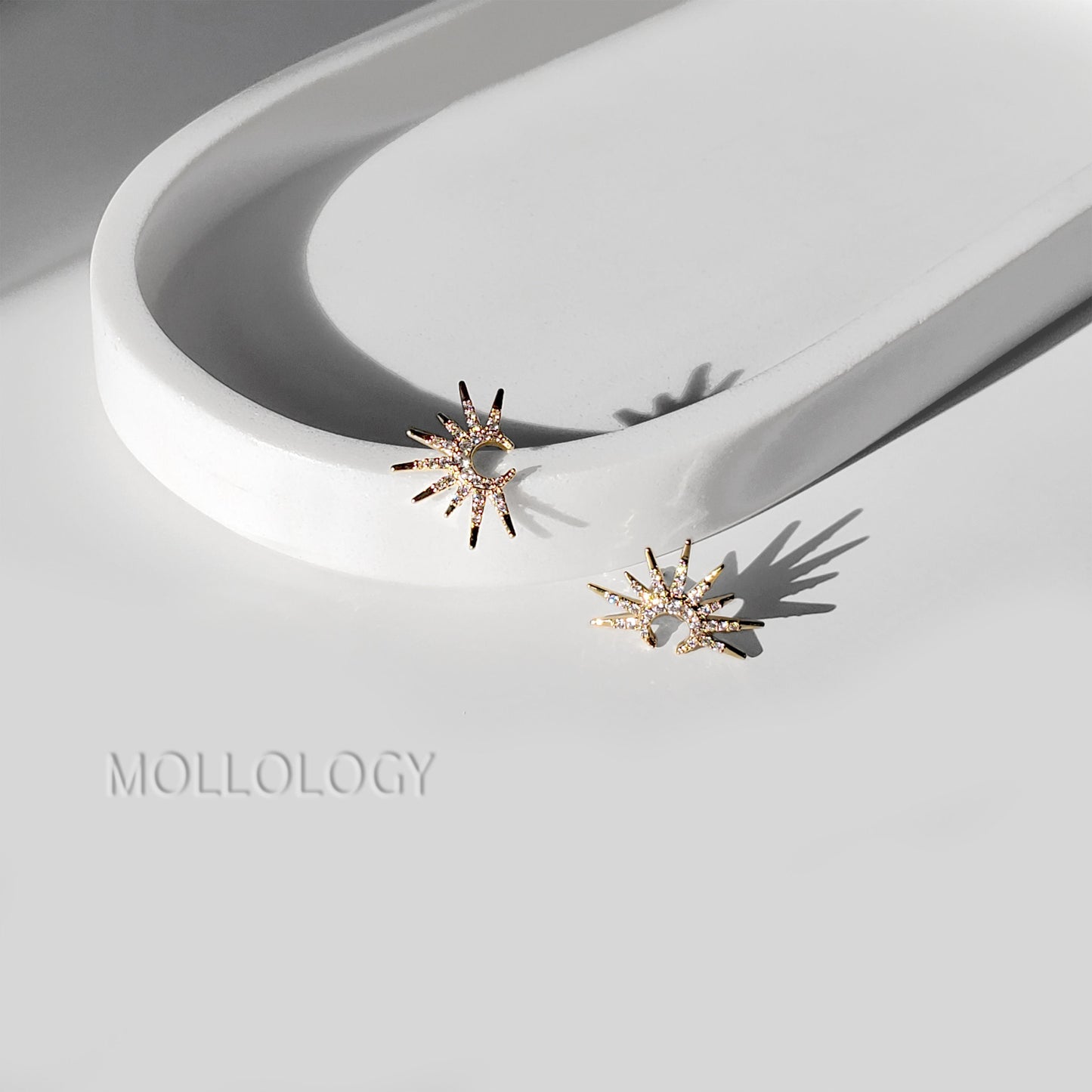 Dainty gold sunburst earrings featuring a radiant starburst floral design with sparkling CZ accents. Mid-century inspired fan earrings, perfect for bridal and bridesmaid jewelry, weddings, special occasions, or elegant everyday wear. A timeless gold statement and beautiful gift for her.