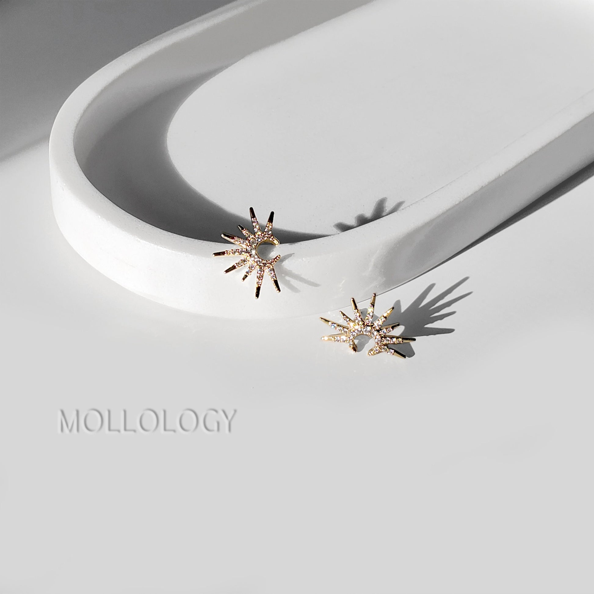 Dainty gold sunburst earrings featuring a radiant starburst floral design with sparkling CZ accents. Mid-century inspired fan earrings, perfect for bridal and bridesmaid jewelry, weddings, special occasions, or elegant everyday wear. A timeless gold statement and beautiful gift for her.