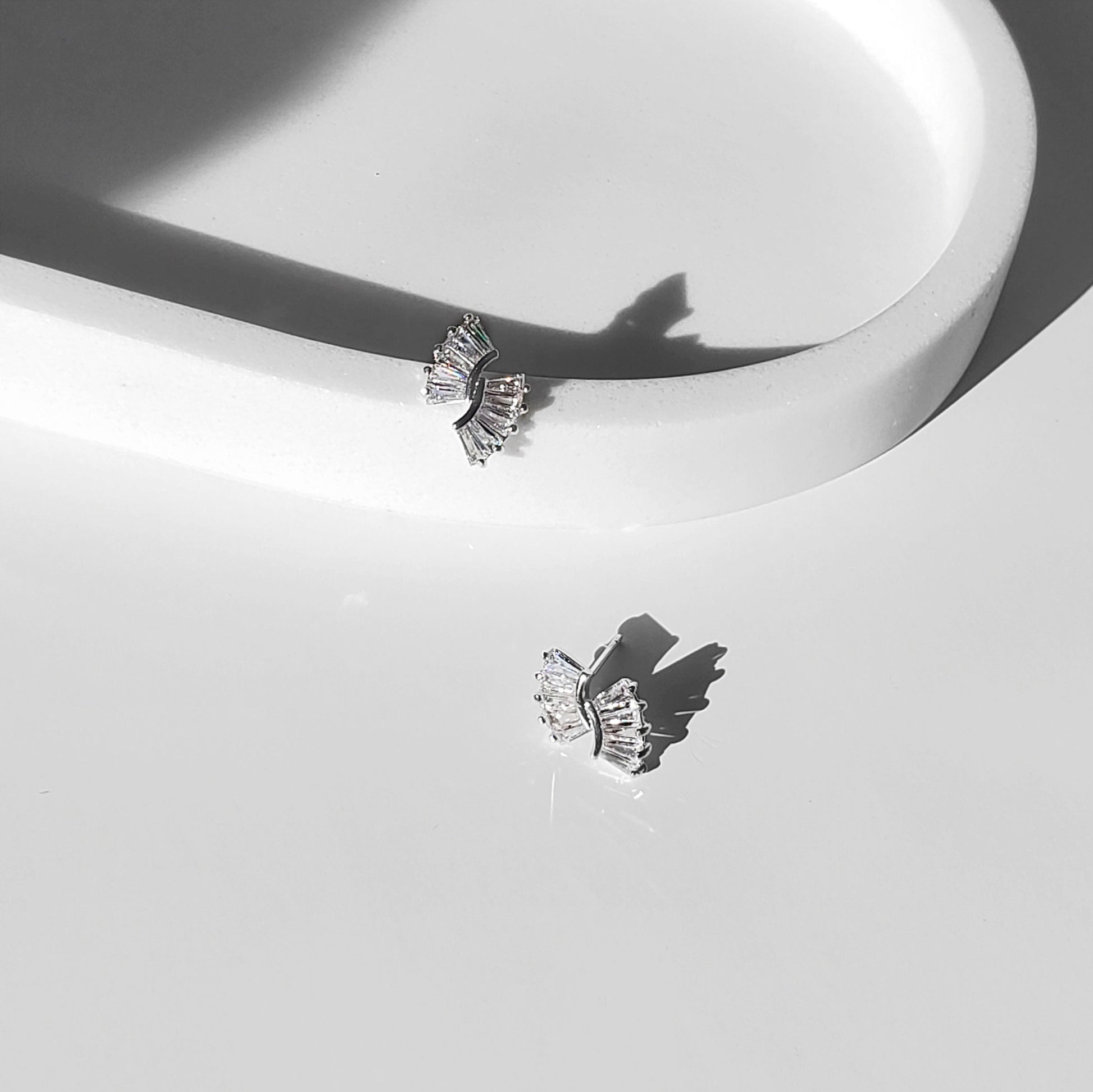 This elegant Art Deco–inspired design makes a beautiful choice for brides, bridesmaids, and anyone who loves timeless sparkle. These baguette bridal earrings feature dainty CZ sunburst studs available in gold or silver, perfect for minimalist wedding earrings that still make a statement.